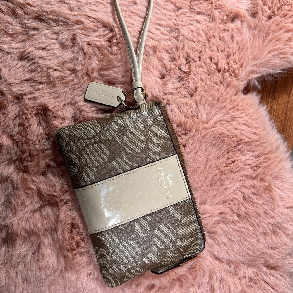 Brand new Coach Corner Zip wristlet in silver signature canvas